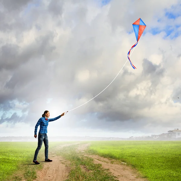 Woman with kite — Stock Photo, Image