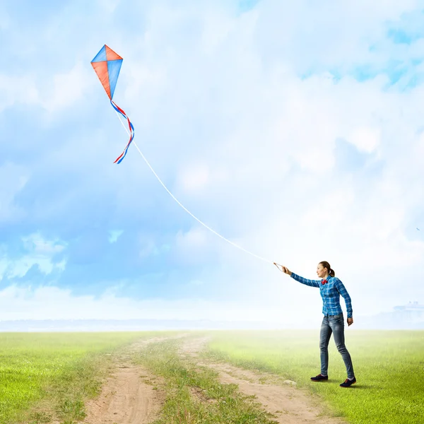 Woman with kite — Stock Photo, Image