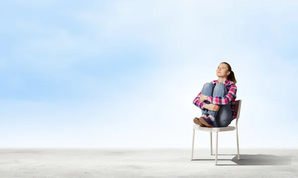 Girl in chair — Stock Photo, Image