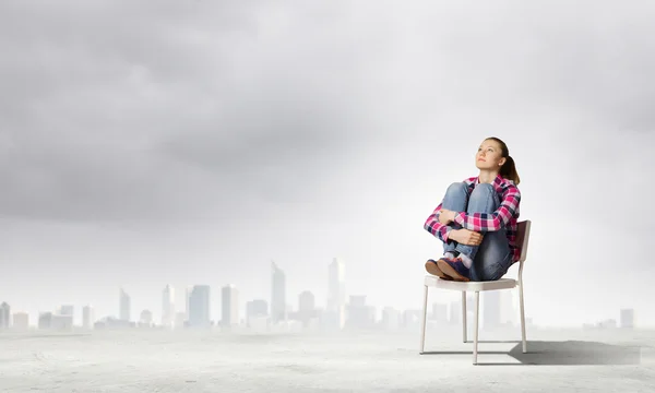 Girl in chair — Stock Photo, Image