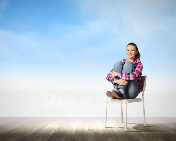 Girl in chair — Stock Photo, Image