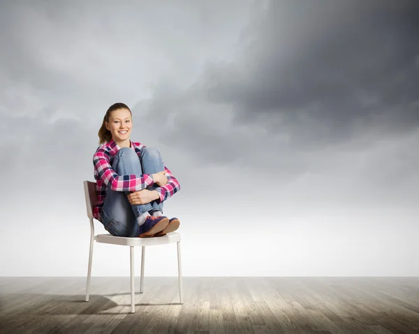 Girl in chair — Stock Photo, Image