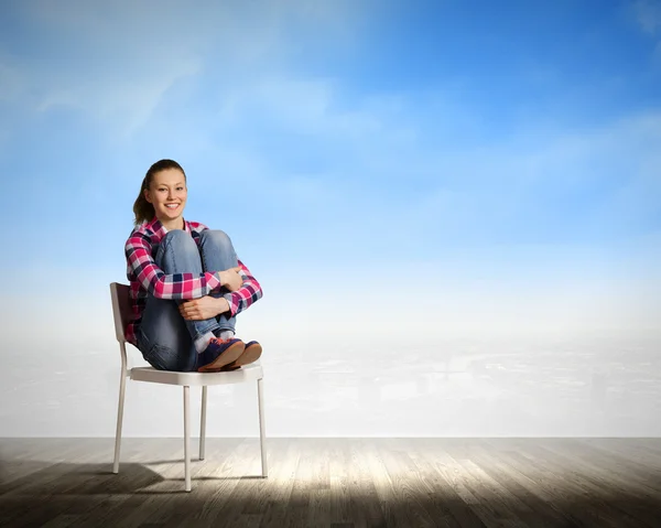 Girl in chair — Stock Photo, Image