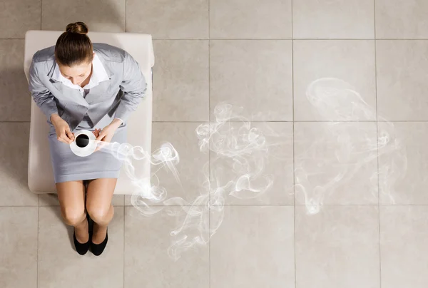 Businesswoman on chair — Stock Photo, Image