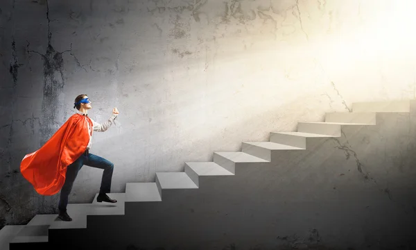 Superman on ladder — Stock Photo, Image