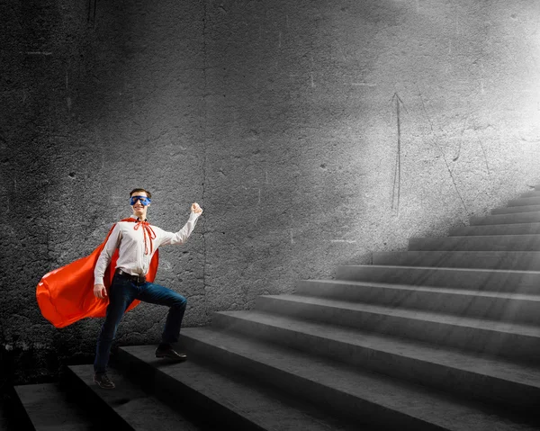 Superman on ladder — Stock Photo, Image