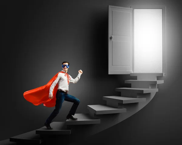 Superman on ladder — Stock Photo, Image