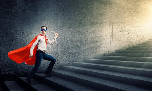 Superman na drabinie — Zdjęcie stockowe