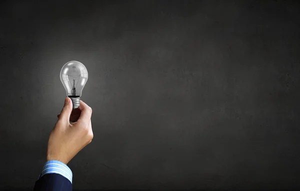 Bulb in hand — Stock Photo, Image