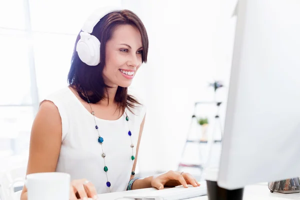 Woman in headphones — Stock Photo, Image