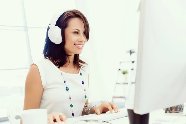 Woman in headphones — Stock Photo, Image