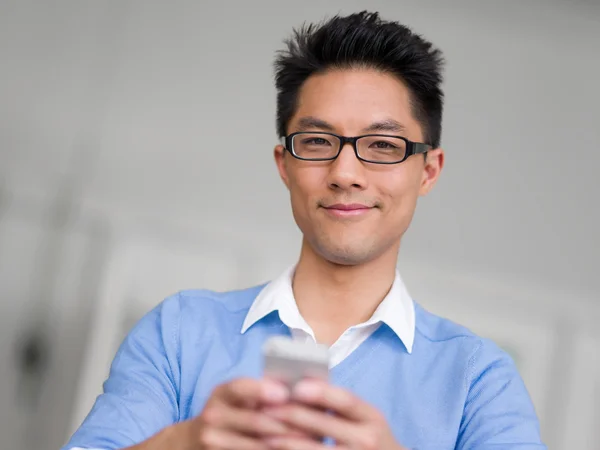 Portrait of young businessman with mobile — Stock Photo, Image