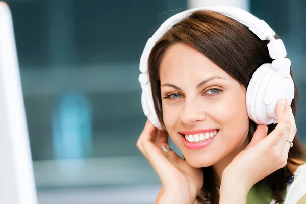 Woman in headphones — Stock Photo, Image