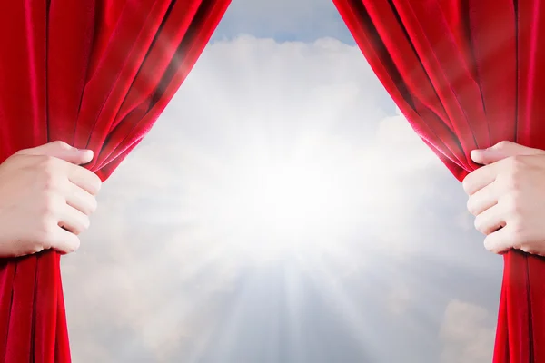 Close up of hand opening red curtain — Stock Photo, Image