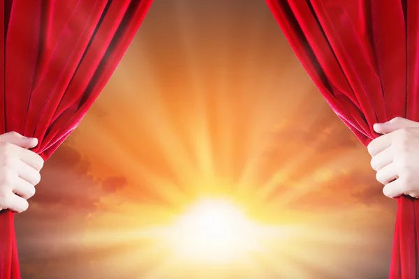 Close up of hand opening red curtain — Stock Photo, Image