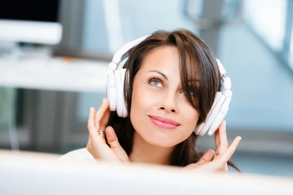 Woman in headphones — Stock Photo, Image