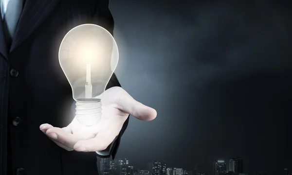 Light bulb in hand — Stock Photo, Image