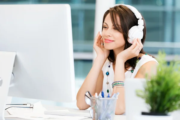 Woman in headphones — Stock Photo, Image