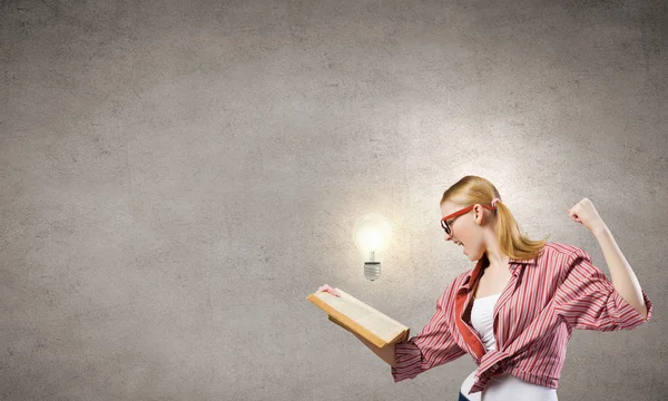 Girl excited with book — Stock Photo, Image