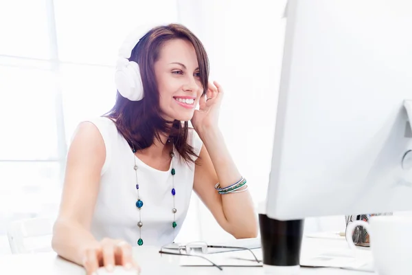 Woman in headphones — Stock Photo, Image