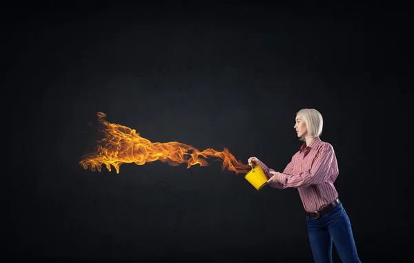 Girl splashing fire flames — Stock Photo, Image