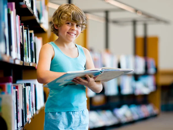 Boy in library — Stock Photo, Image