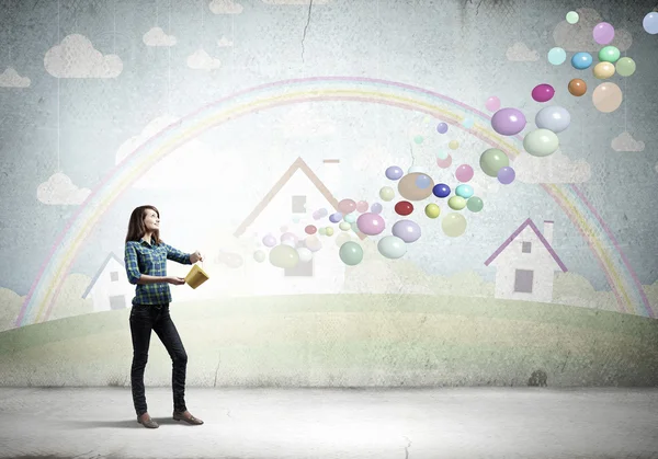 Young pretty woman with yellow bucket — Stock Photo, Image