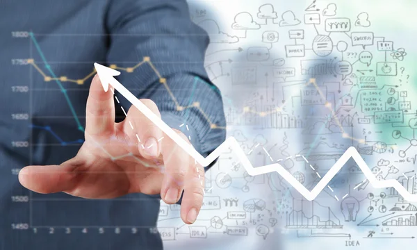 Företag och finans diagram och finger — Stockfoto