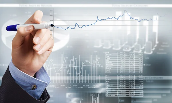 Business en finance grafiek en vinger — Stockfoto