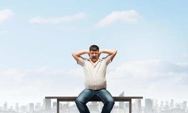 Fat man sitting Stock Photos, Royalty Free Fat man sitting Images