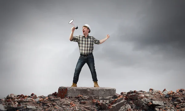 Builder making announcement — Stock Photo, Image