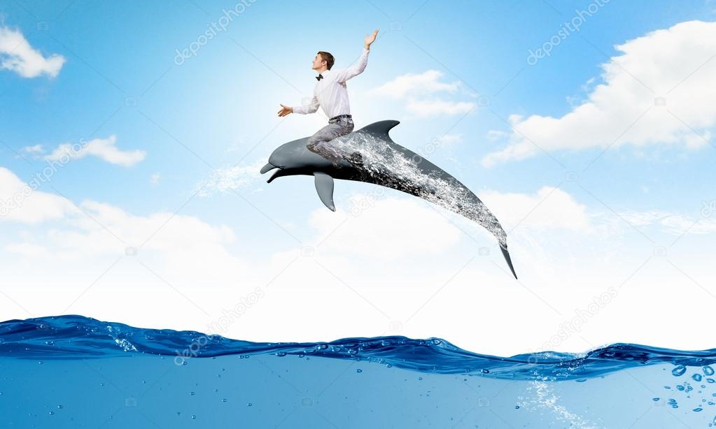 Man ride dolphin