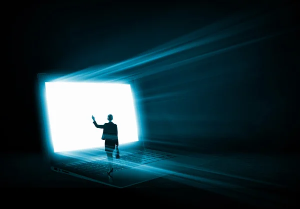 Woman standing on big laptop — Stock Photo, Image