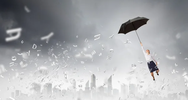 Woman fly on umbrella — Stock Photo, Image