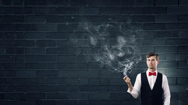 Businessman and pipe smoke — Stock Photo, Image