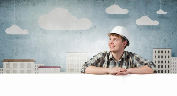 Builder with billboard — Stock Photo, Image