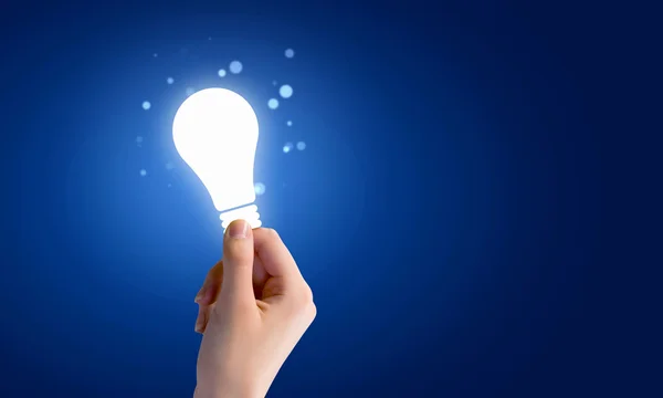 Light bulb in hand — Stock Photo, Image