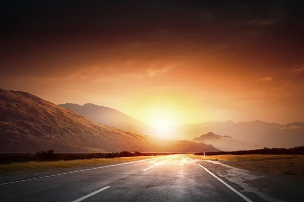 Salida del sol sobre la carretera — Foto de Stock