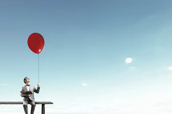 Empresário com balão — Fotografia de Stock