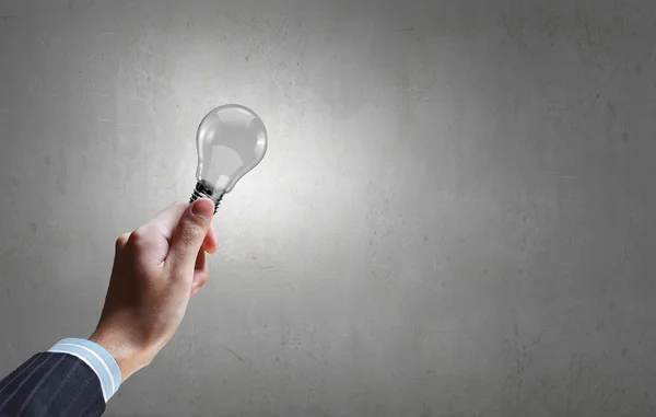 Bulb in hand — Stock Photo, Image