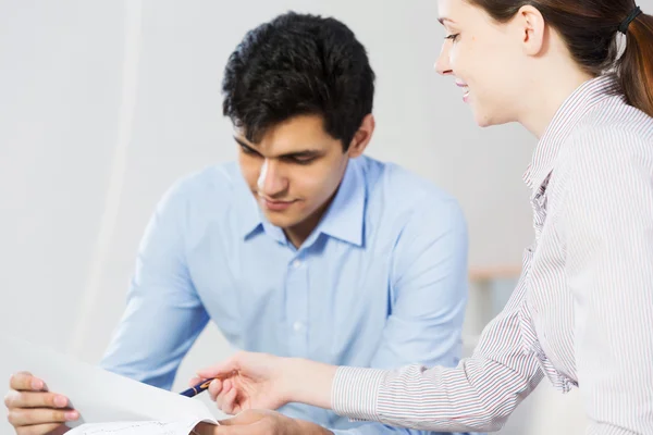 Two young people working as partners Stock Image