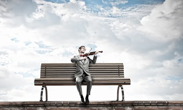 Businessman play violin — Stock Photo, Image