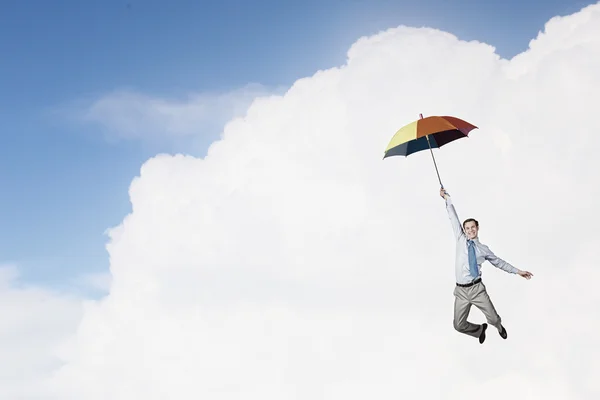 Man fly on umbrella — Stock Photo, Image