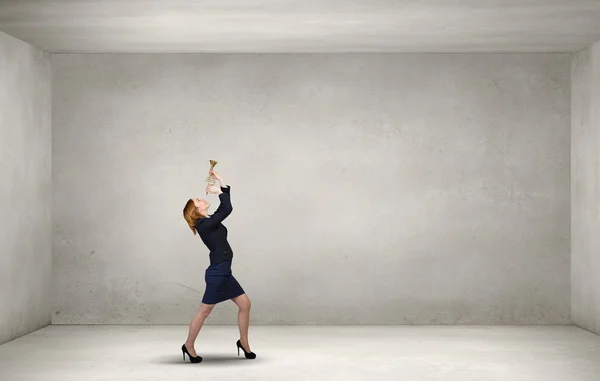 Woman speaking in horn — Stock Photo, Image