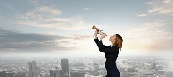 Woman speaking in horn — Stock Photo, Image