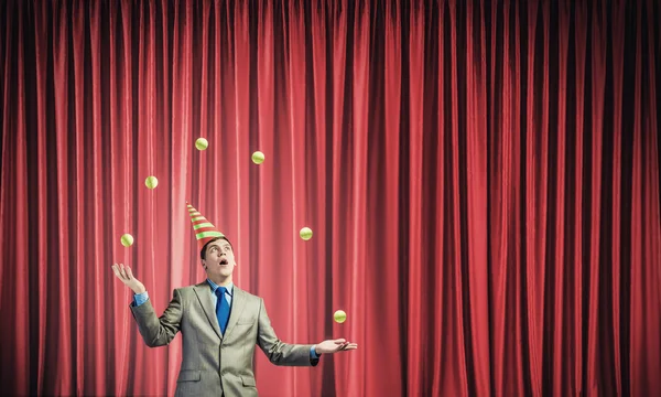 Businessman juggling with balls — Stock Photo, Image