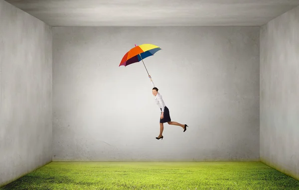 Woman fly on umbrella — Stock Photo, Image