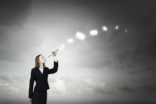 Woman speaking in horn — Stock Photo, Image