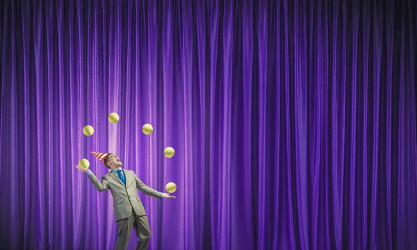 Businessman juggling with balls — Stock Photo, Image