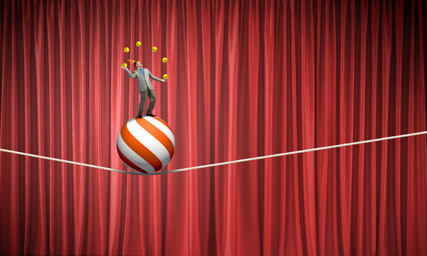 Businessman juggling with balls